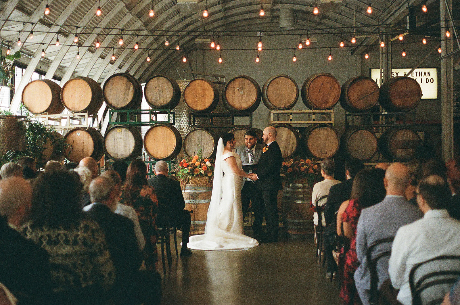 newlyweds holding hands during their Coopers Hall wedding.
