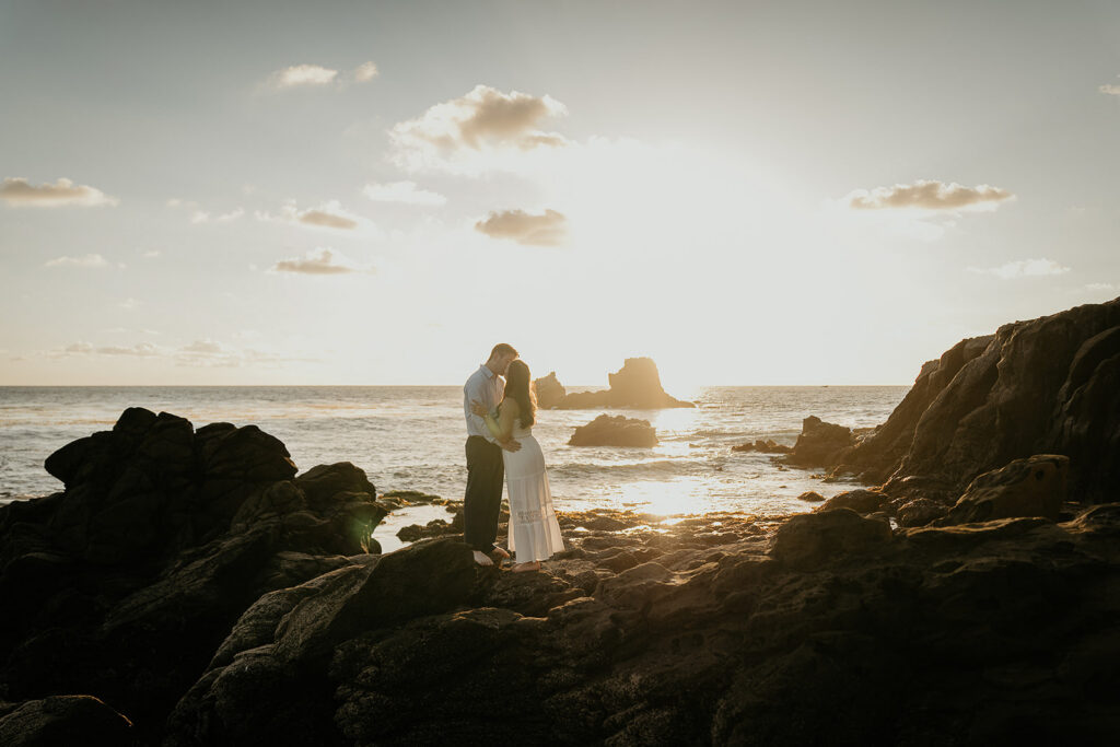 couple kissing during sunset during their Laguna Beach engagement.