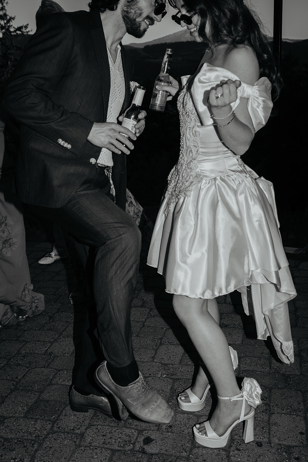 the newlyweds dancing and enjoying the end of their vintage inspired wedding.