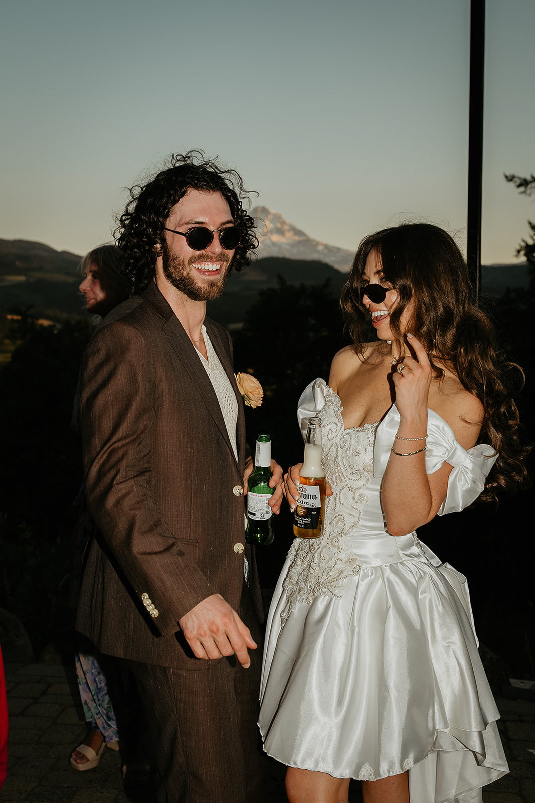 newlyweds smiling and partying at the end of their vintage inspired wedding.