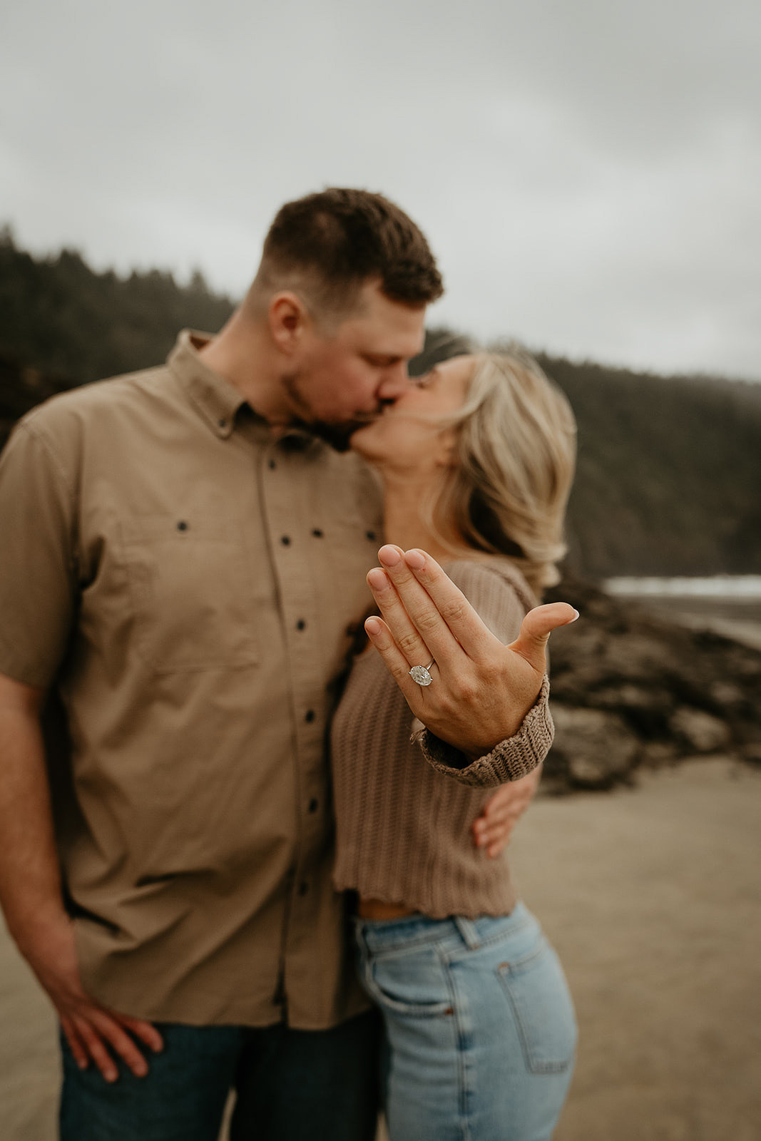 fiance holding up her ring after her classic proposal, one of the ways to propose.