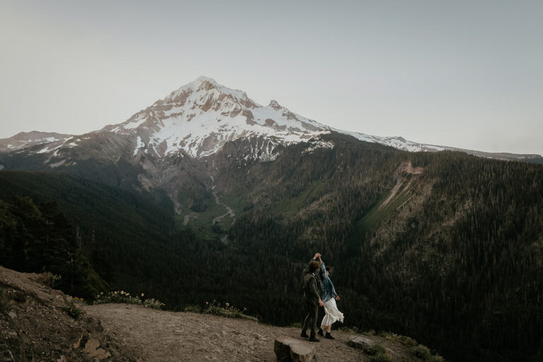 couple dancing in front of mount Hood during their wedding anniversary photoshoot.