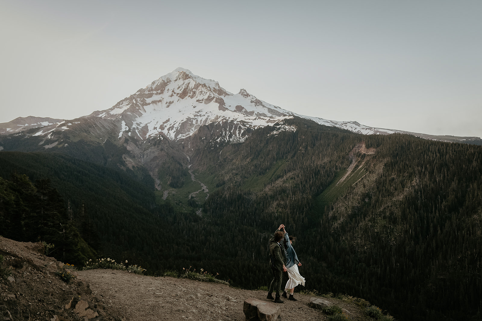 couple dancing in front of mount Hood during their wedding anniversary photoshoot.