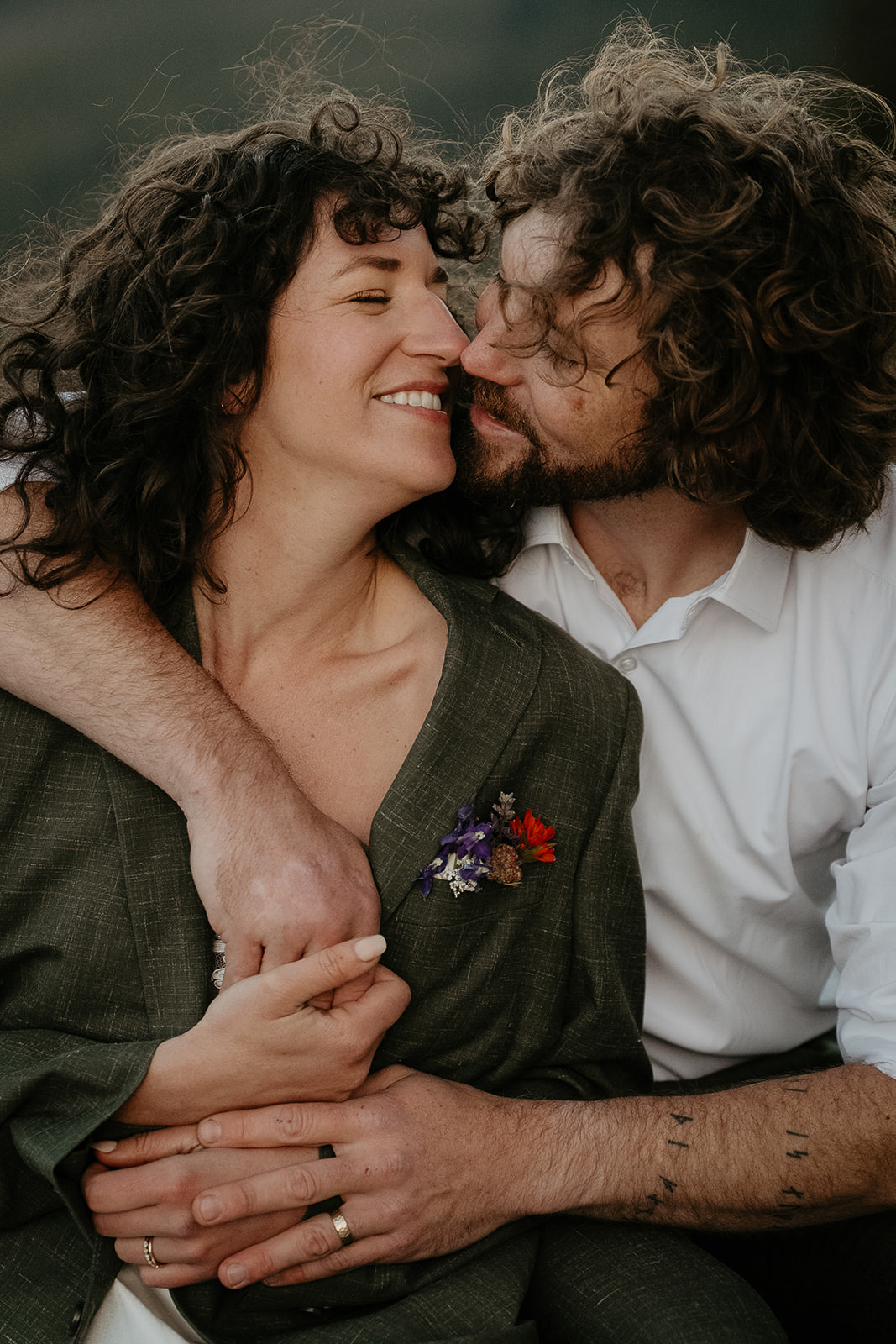 couple kissing and hugging each other.