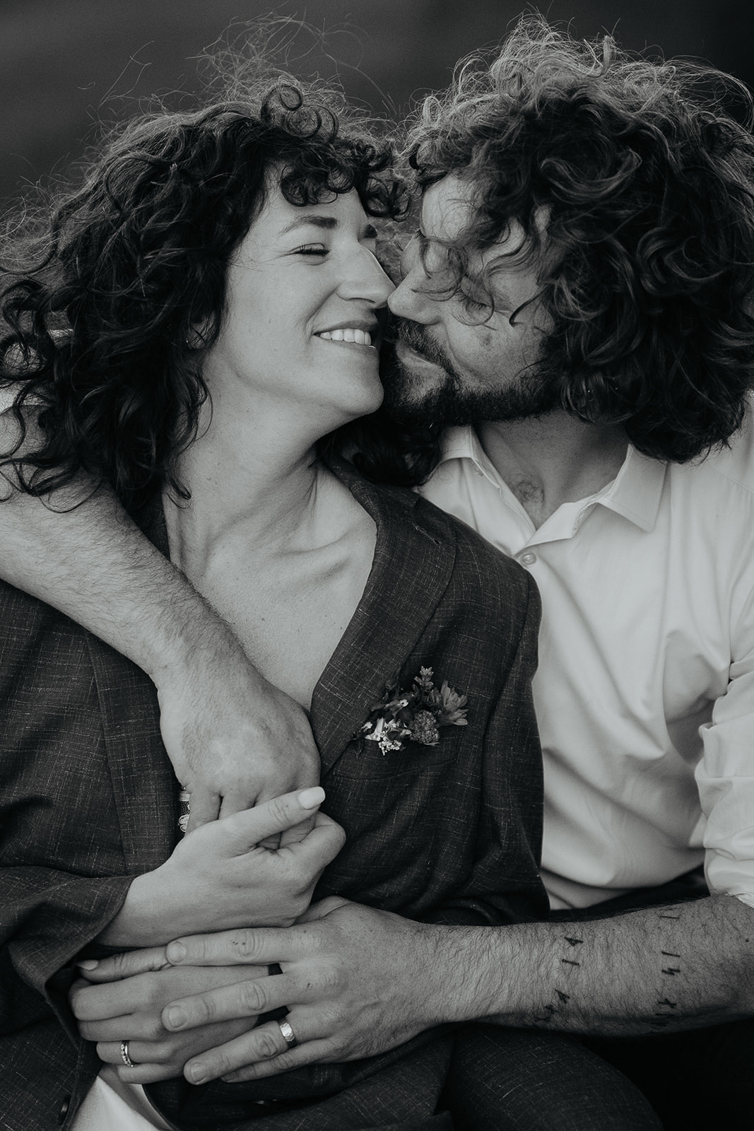 couple hugging about to kiss.