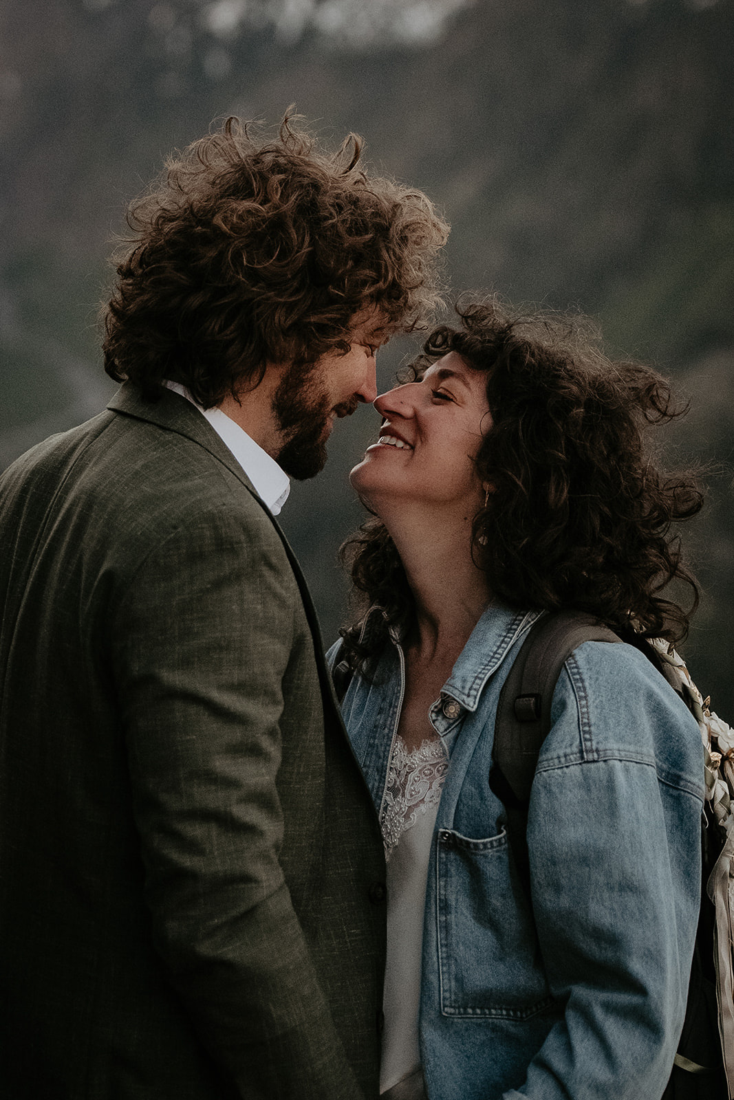 couple hugging about to kiss.
