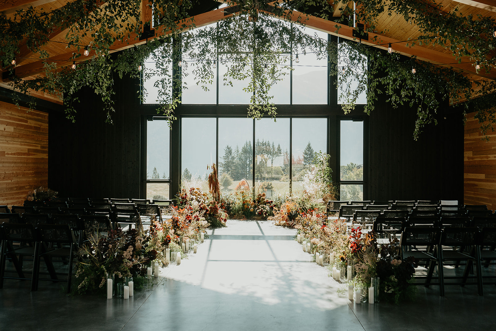 The inside of Wind Mountain Ranch decorated for a wedding ceremony.