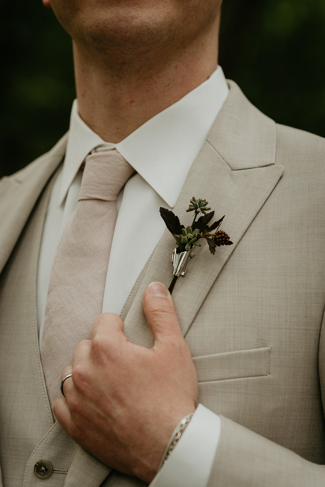 A suit's lapel holding a flower.
