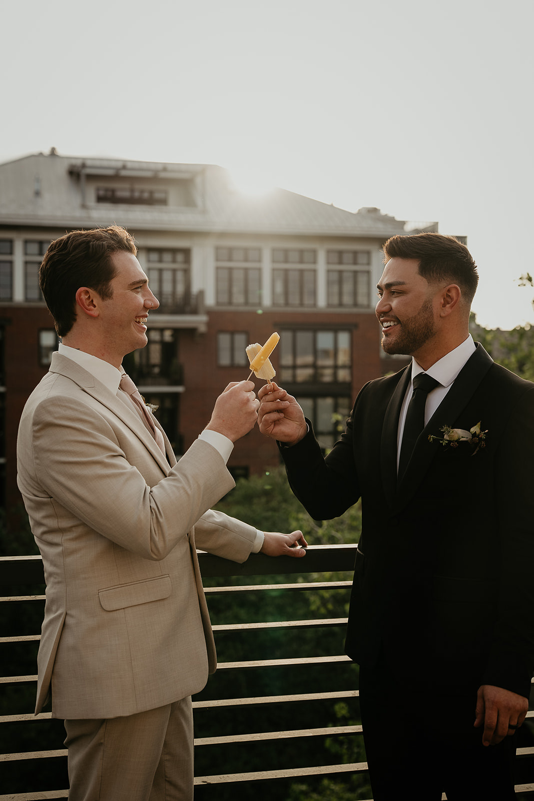 newlywed cheersing popsicles for an Ecotrust wedding styled shoot.