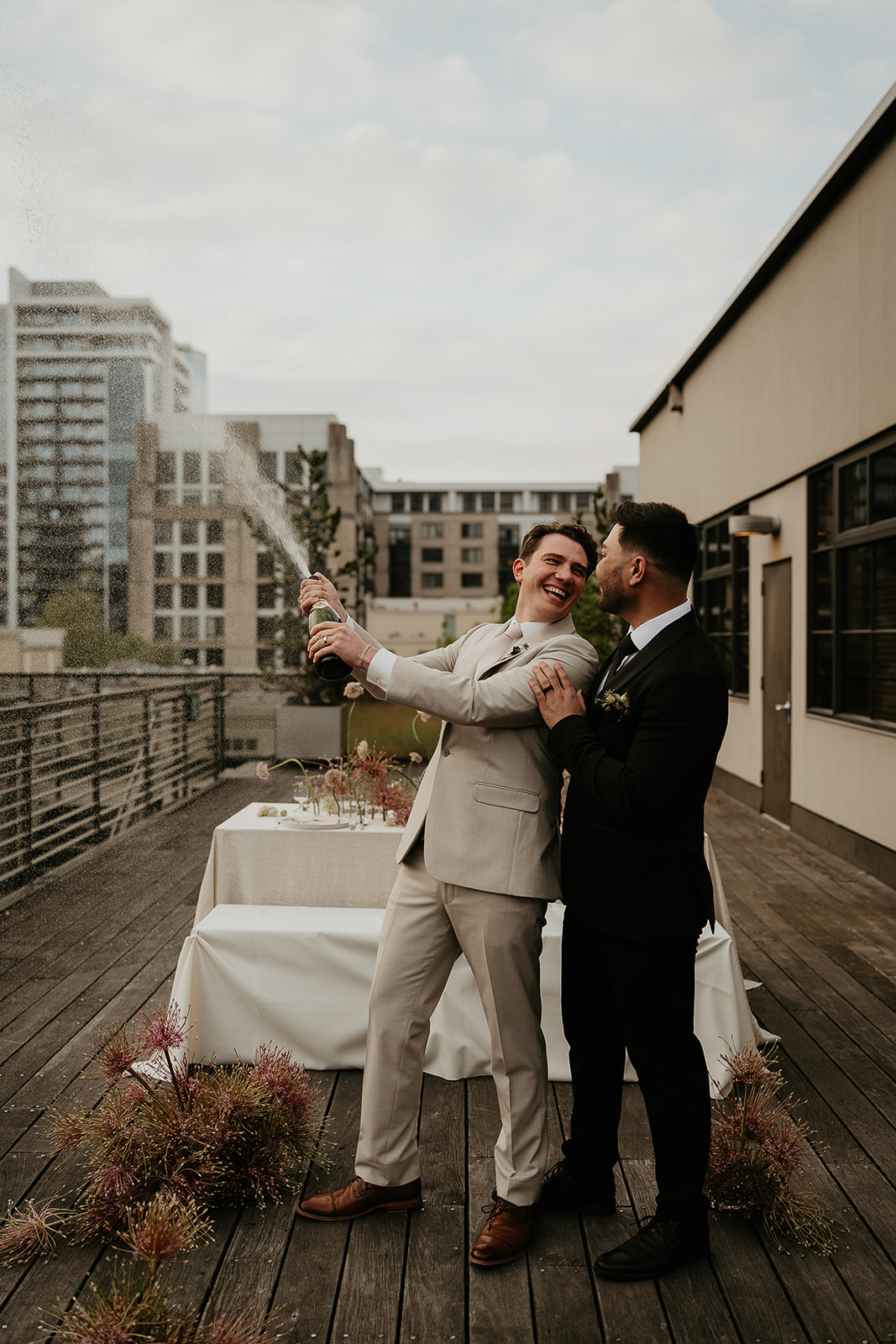 Newlyweds popping champagne.