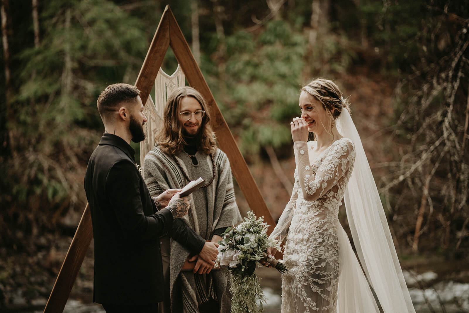 Bride laughing during elopement ceremony at Mt Rainier