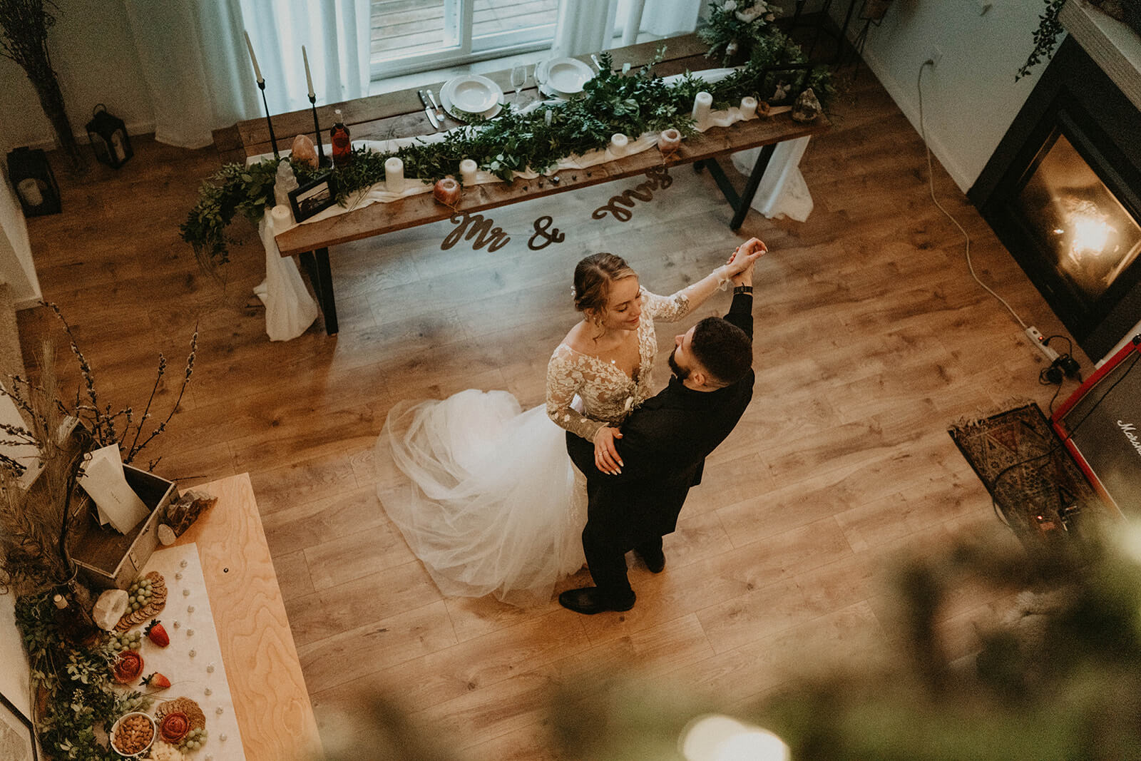 Bride and groom first dance at cozy cabin in Mount Rainier