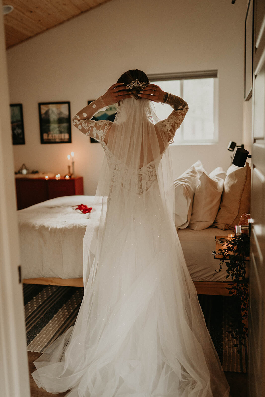 Bride adjusting veil while getting ready