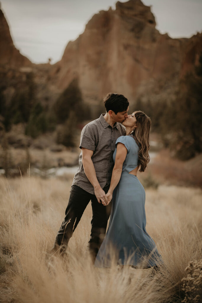 Couple kissing during engagement photography session