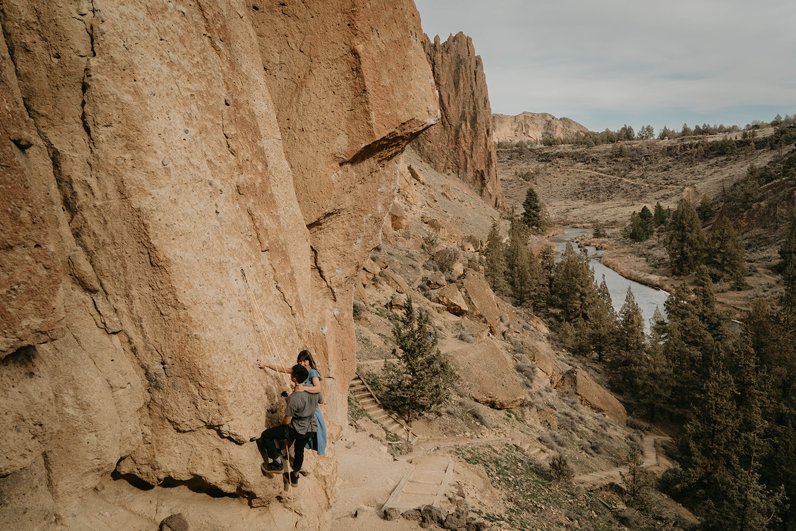 Couple rock climbing at Smith Rock for engagement session