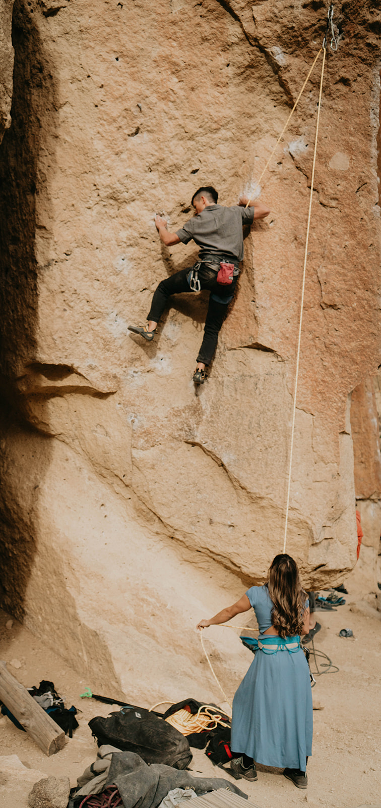 Couple rock climbing at Smith Rock for engagement session