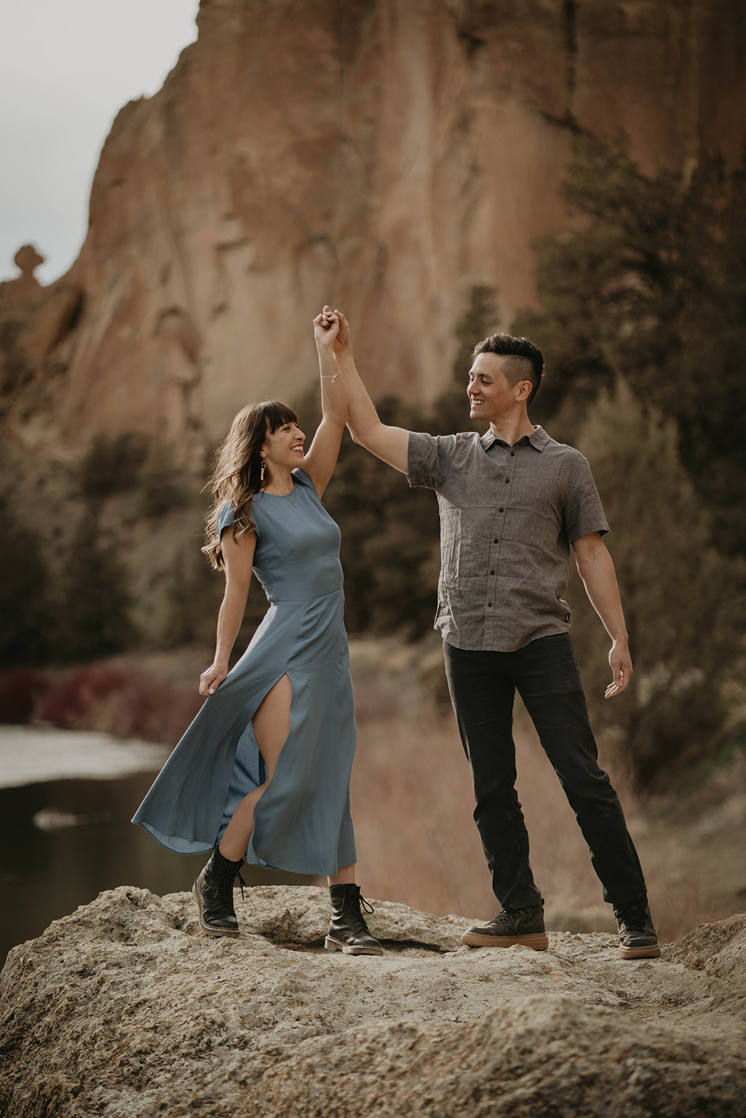 Couple dancing at Smith Rock after rock climbing engagement session