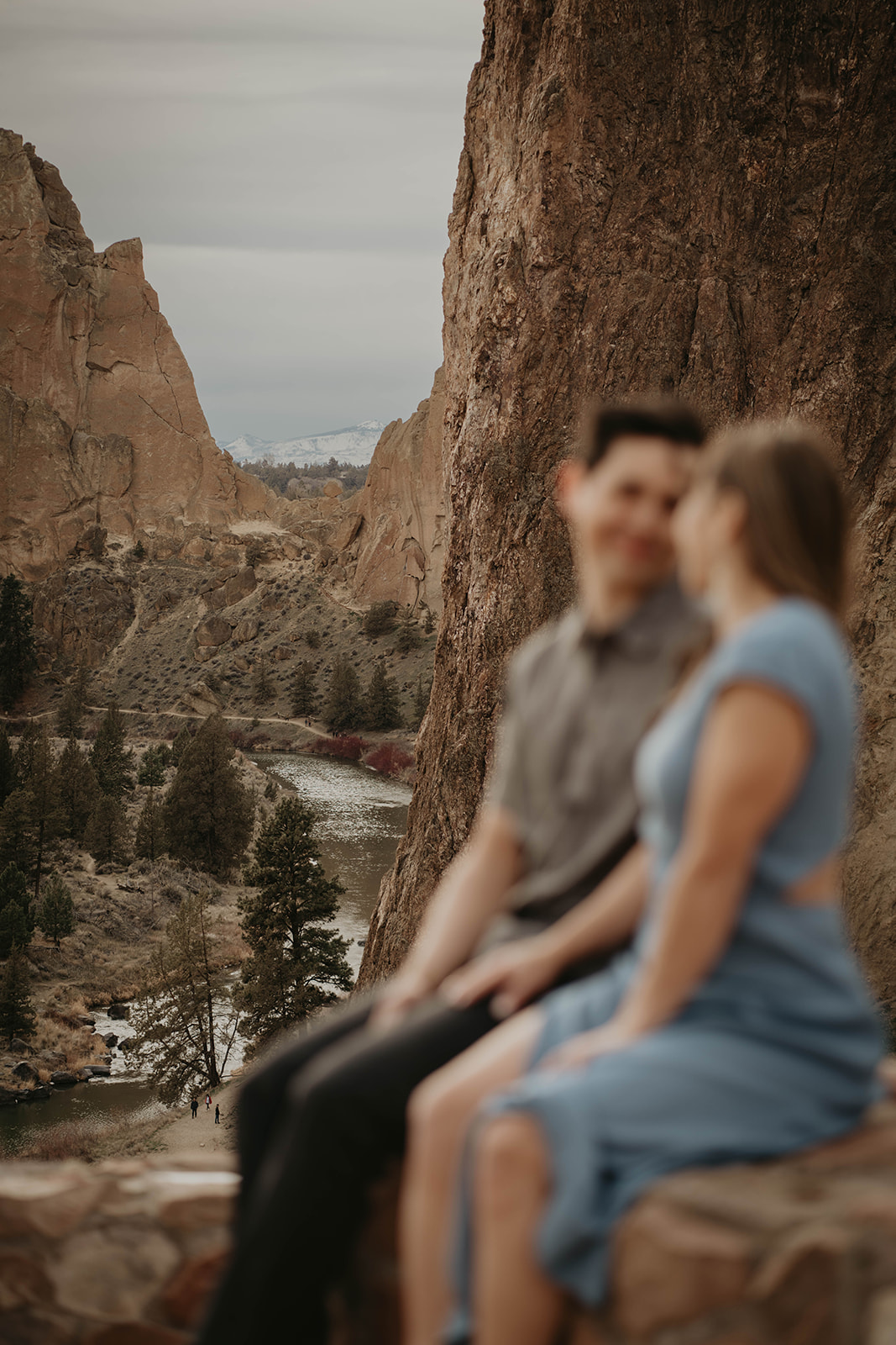 Couple sitting overlooking the river at Smith Rock State Park