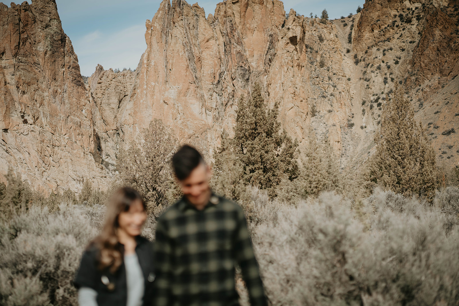 Couple walking along a desert trail at Smith Rock State Park