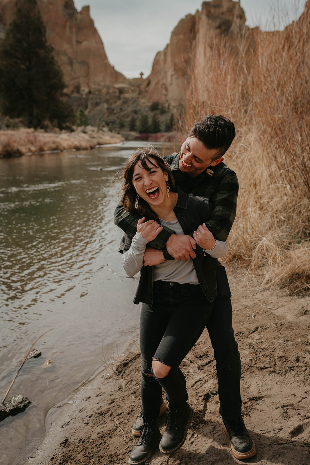 Couple hugging and laughing at Smith Rock State Park