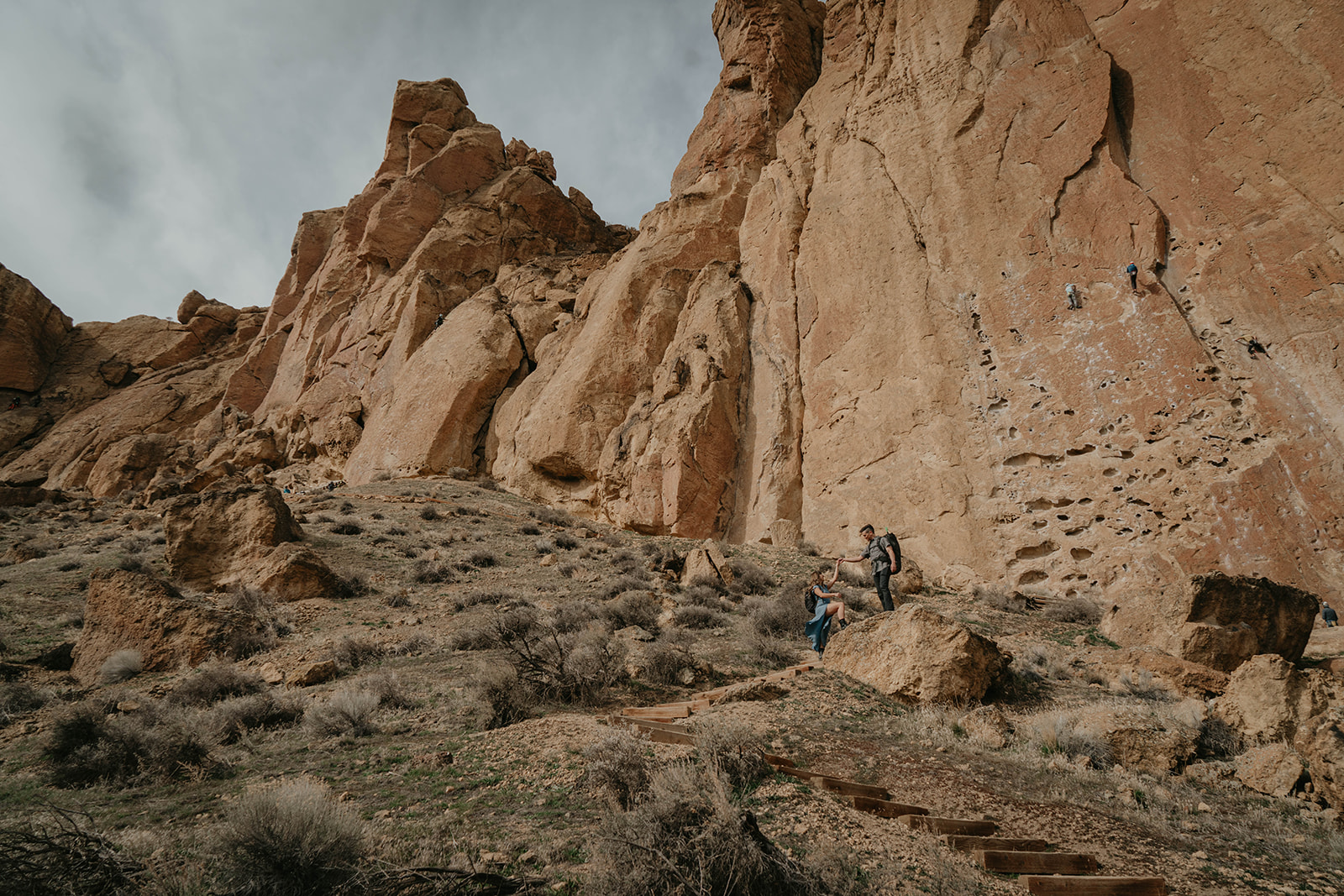 Couple hiking at Smith Rock State Park for engagement session