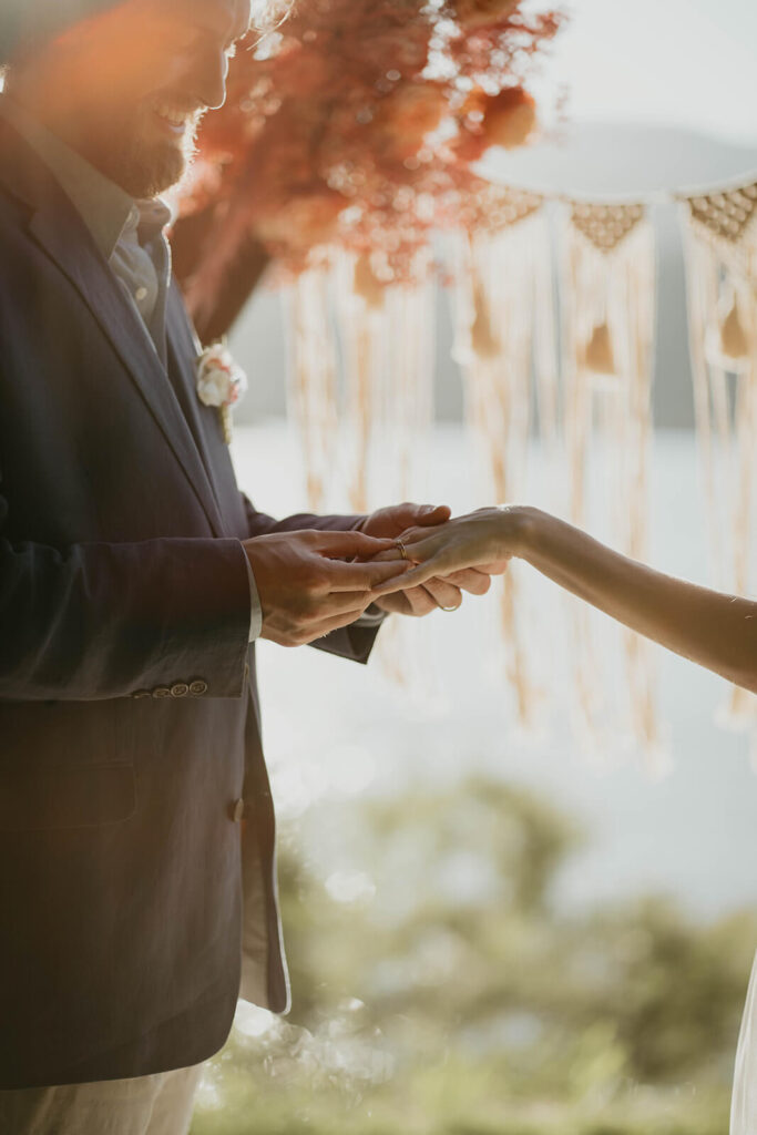 Bride and groom exchanging rings during styled photo shoot