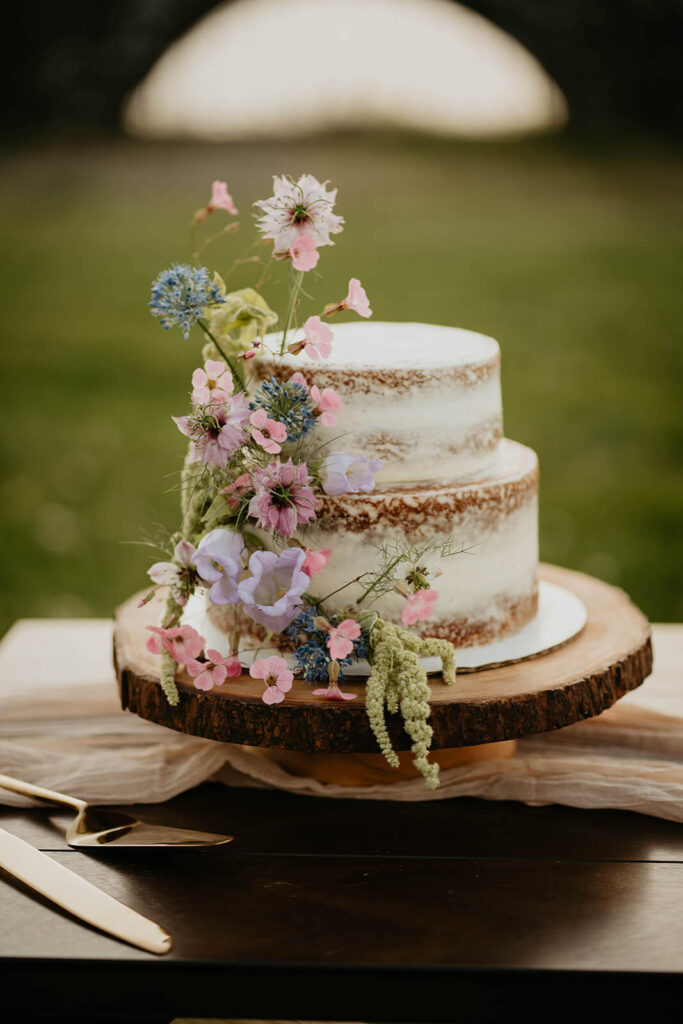 White wedding cake with pastel florals