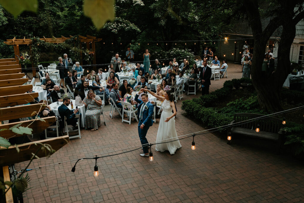 Two brides dancing at Leach Botanical Garden wedding reception