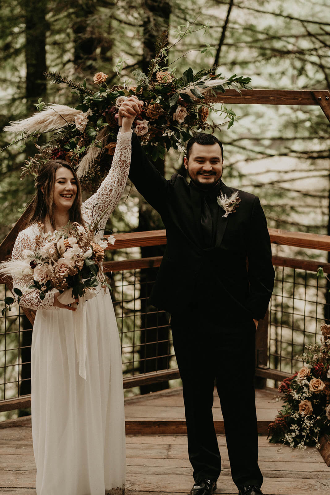 Bride and groom cheer at Hoyt Arboretum wedding ceremony