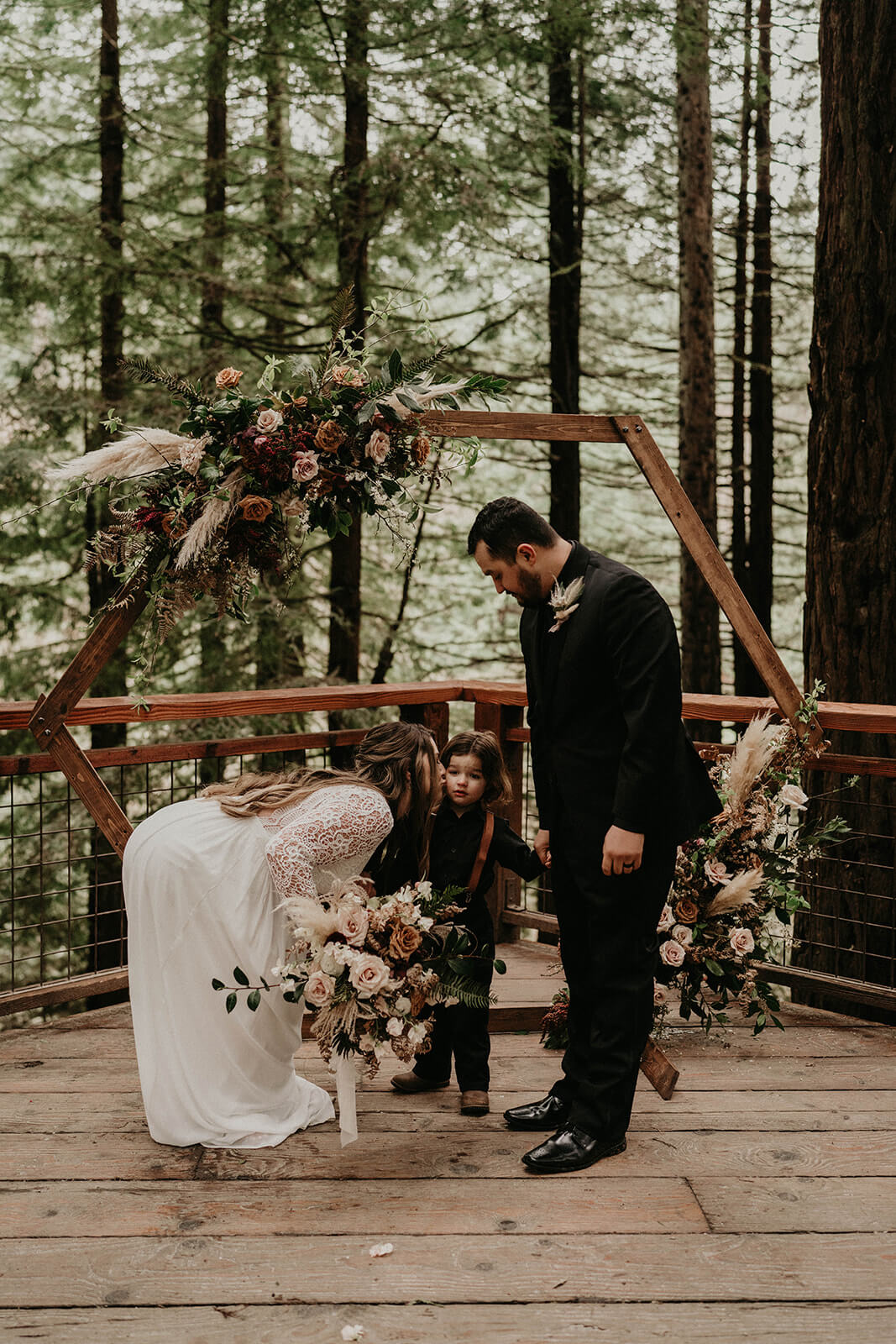 Bride kisses son on the cheek at Hoyt Arboretum wedding