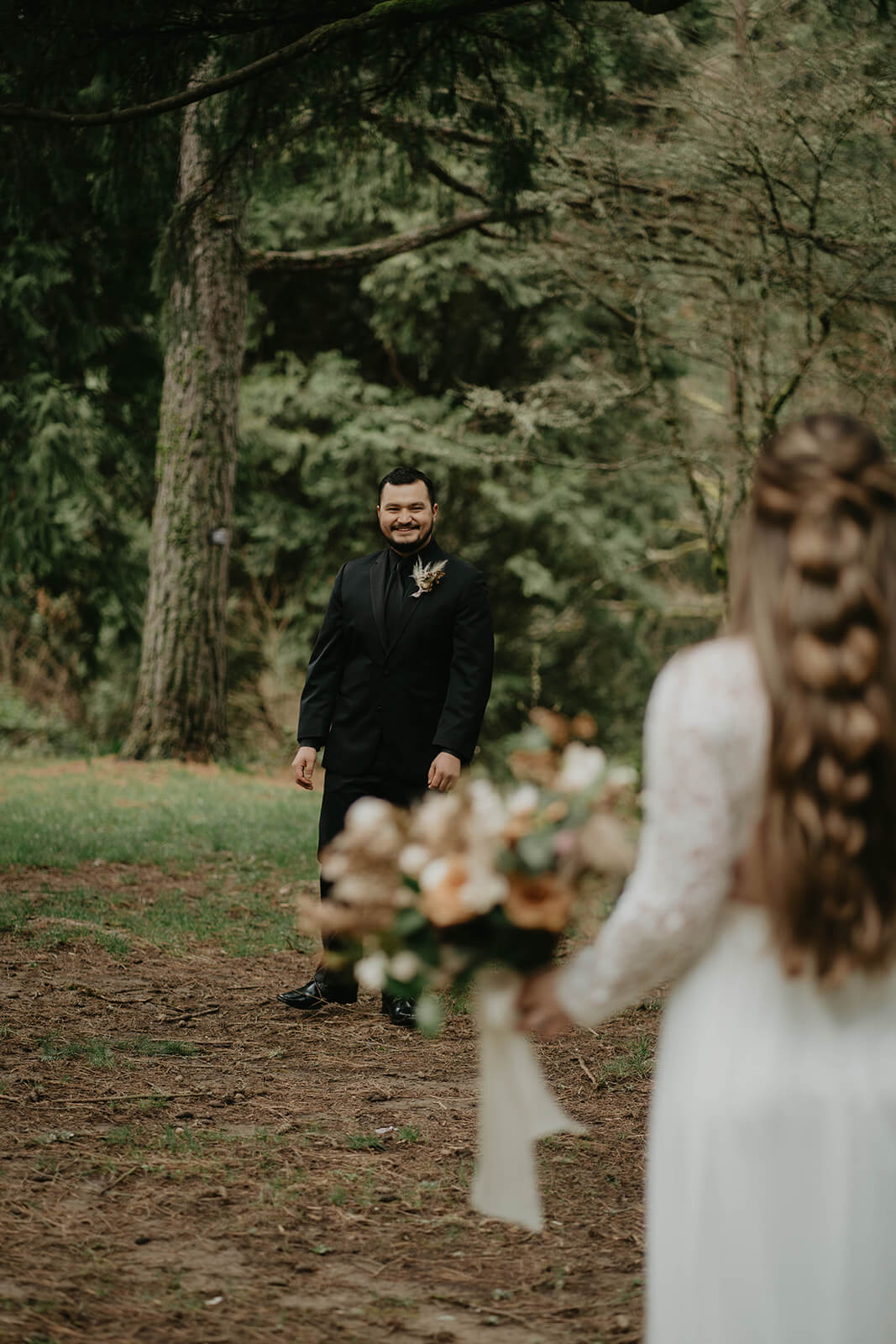Bride and groom first look in the forest at Hoyt Arboretum