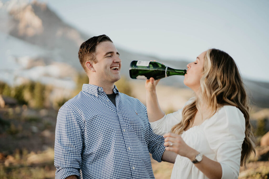 Woman drinking champagne during Mt Hood engagement