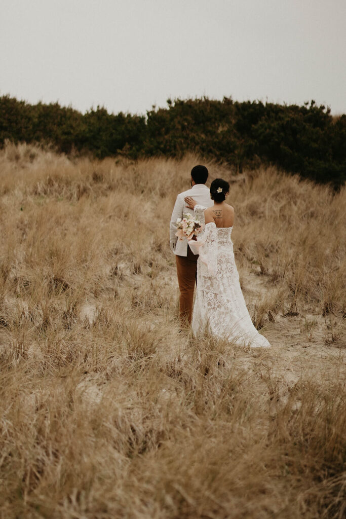 Bride and groom first look during Oregon coast elopement