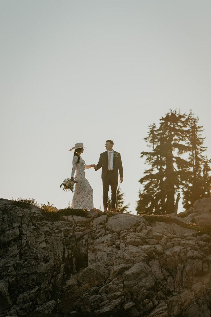 the newlyweds holding hands exploring the North Cascades. 