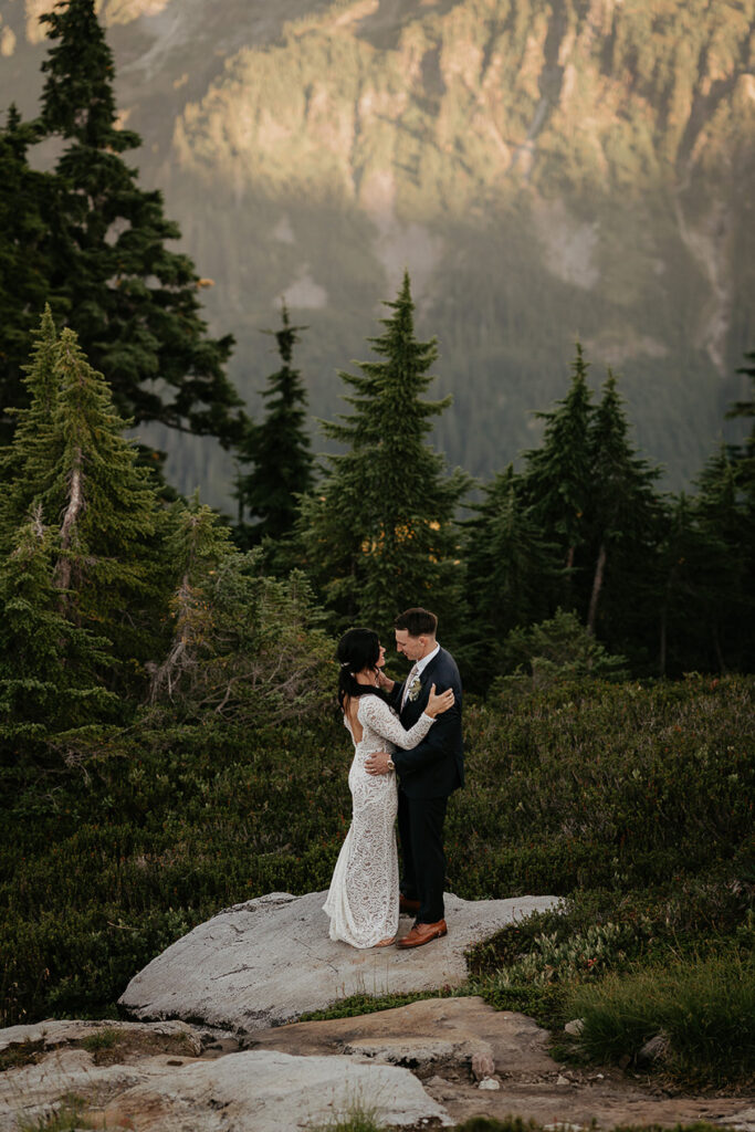 the newlyweds holding each other during their North Cascades elopement. 