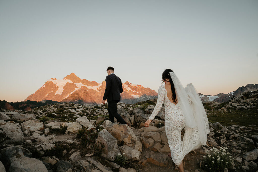 the newlyweds exploring the mountainside on their North Cascades elopement. 