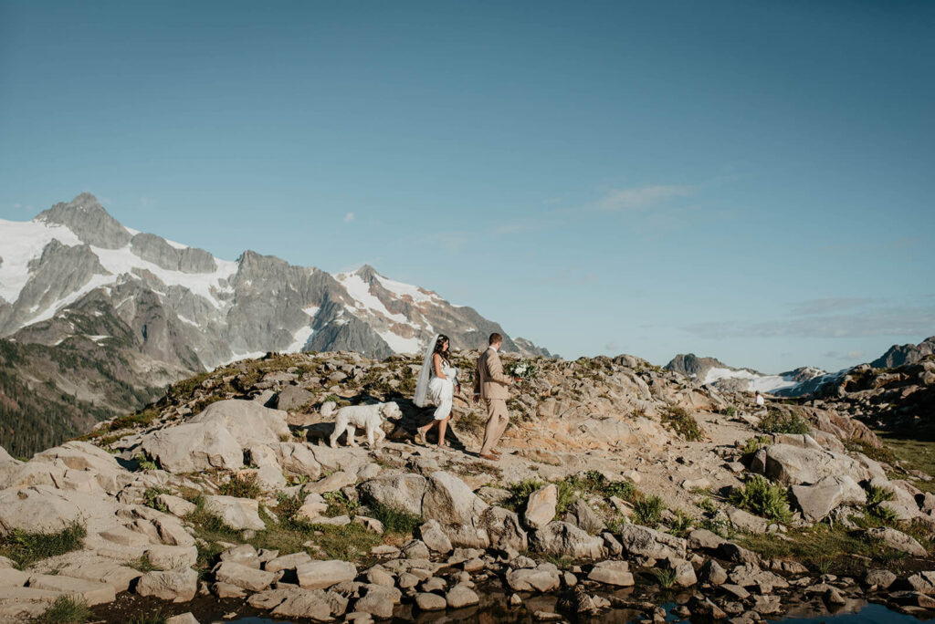 Bride and groom hiking in the North Cascades for their Washington elopement at Artist Point