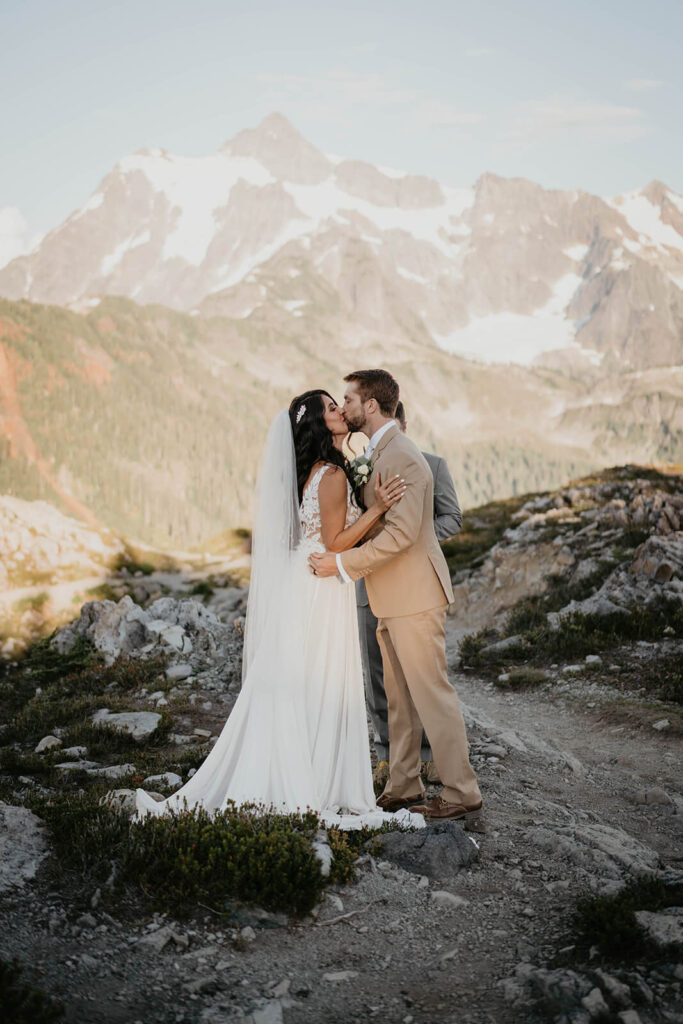 Bride and groom first kiss in the North Cascades