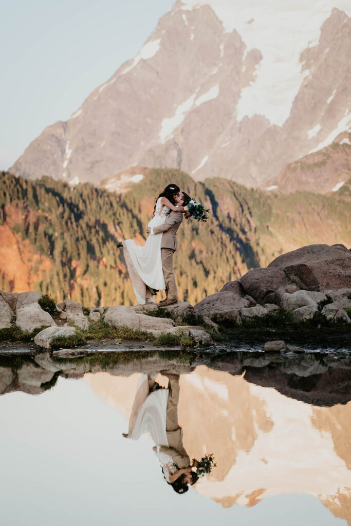 Bride and groom kissing in the North Cascade mountains