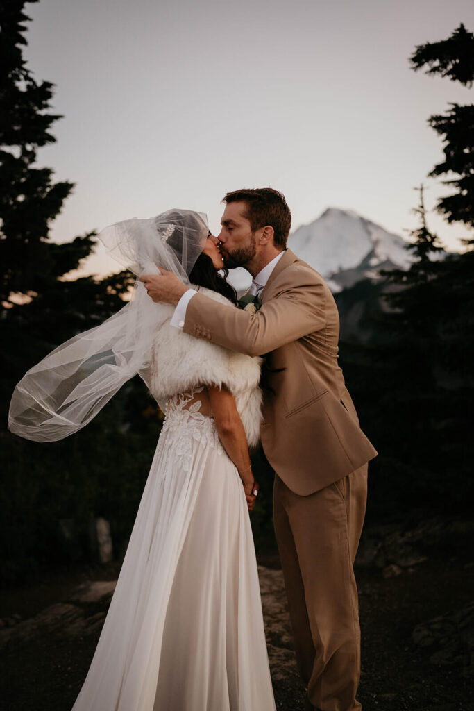 Bride and groom kissing in the North Cascades