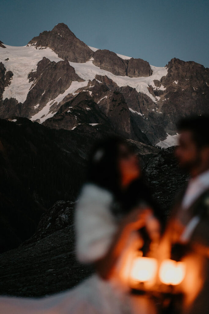 Bride and groom holding lanterns during North Cascades elopement