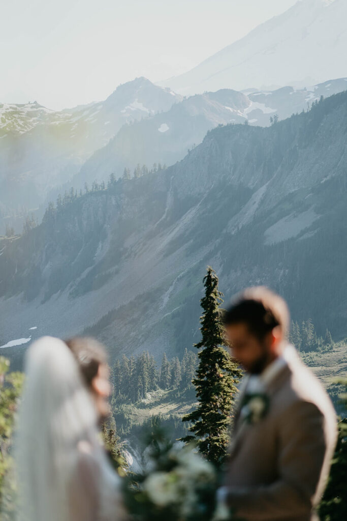 Bride and groom reading personal vows in the North Cascades