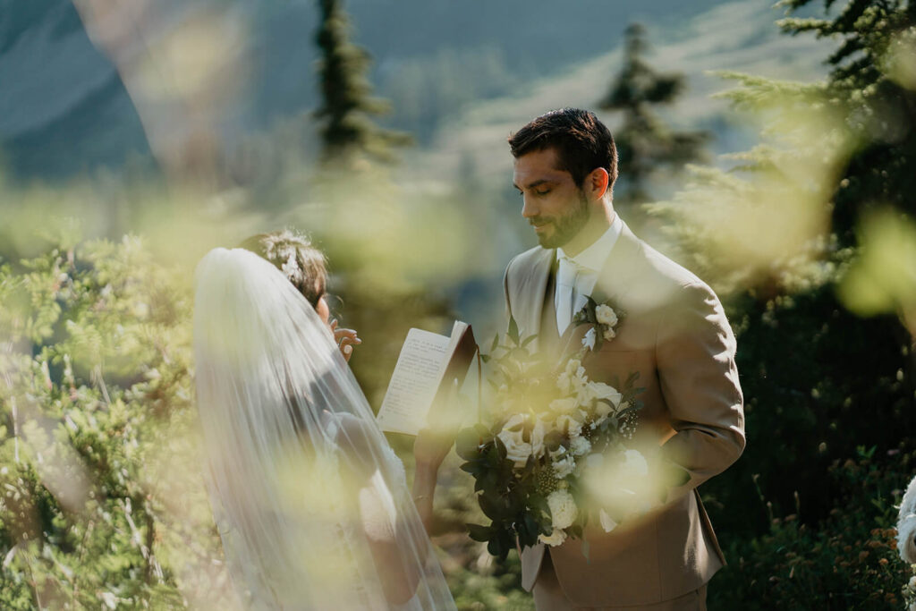Bride and groom reading personal vows before their North Cascades elopement