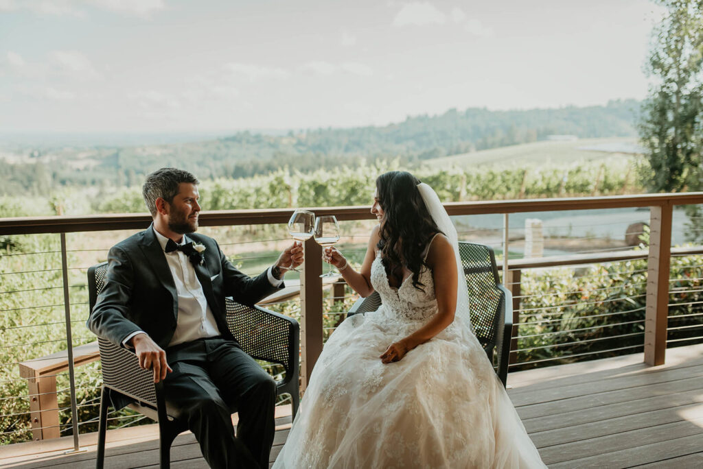 Bride and groom toast with wine at Furioso Vineyards