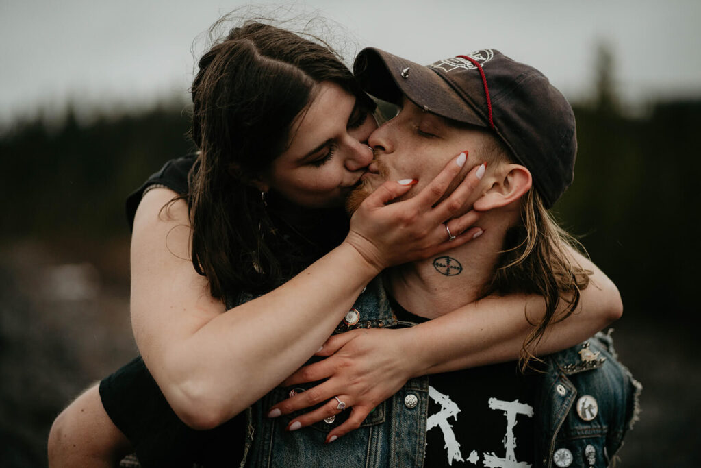 Couple kissing during engagement photo session