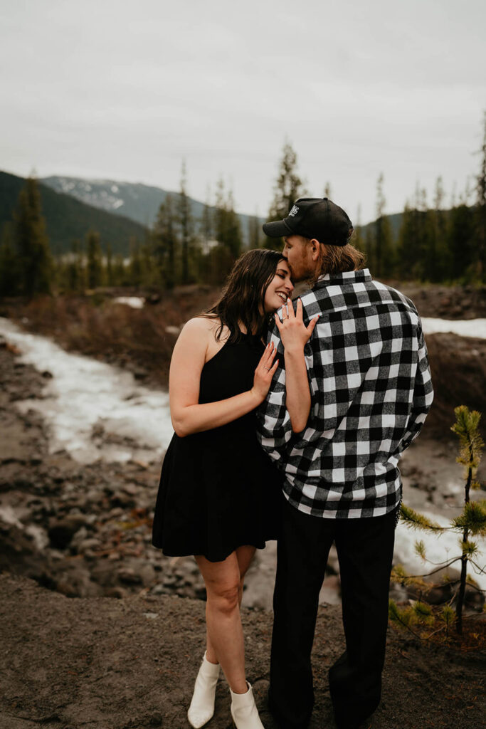 Man kisses woman during unique engagement photos at Mt Hood