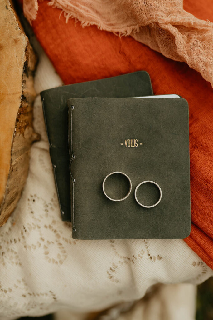 Leather vow books with grooms' rings