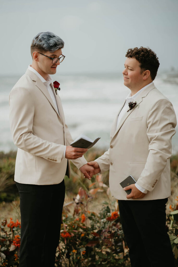 Groom reading wedding vows at outdoor elopement in Oregon