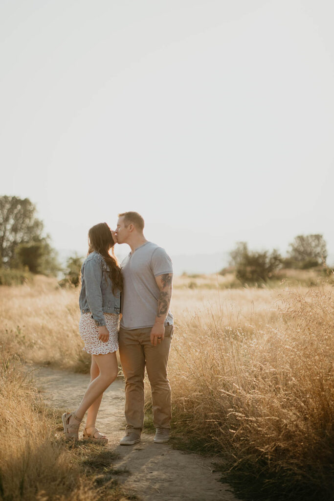 Couple kissing at Discovery Park during their Seattle engagement photo session