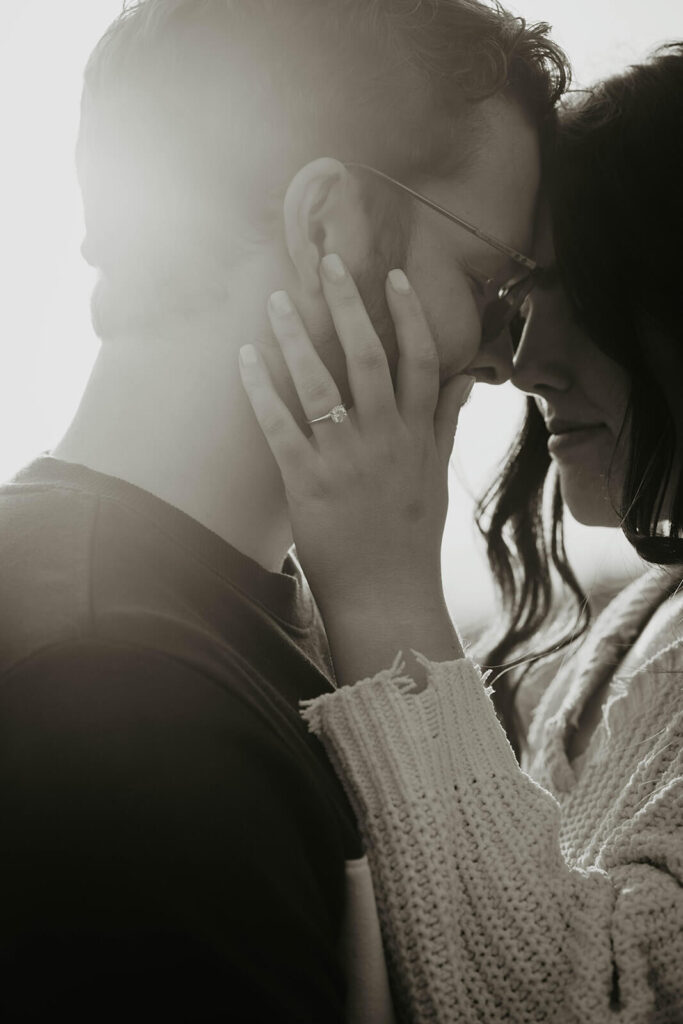 Couple touching foreheads during their Cannon Beach engagement photos